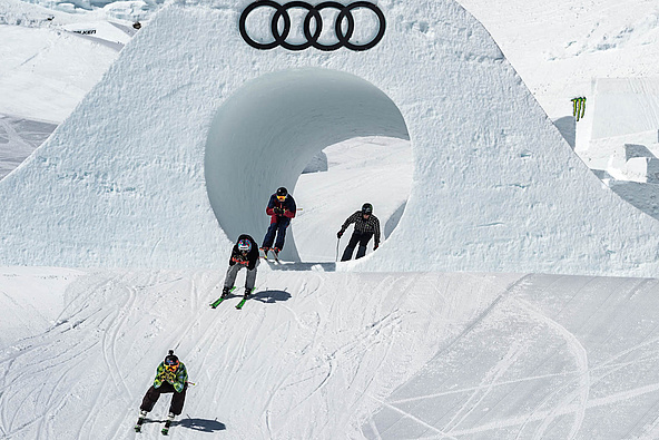 Ski crossers ride through a tube of snow in Soelden 2018