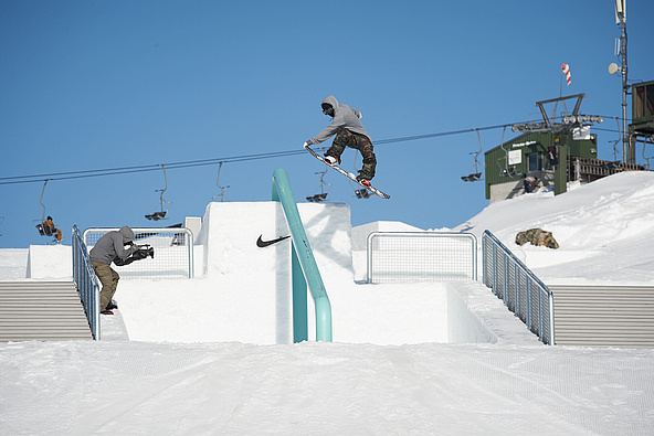 Cameraman films athlete jumping down over rail