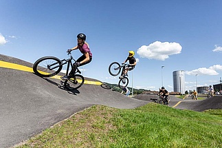 Group of cyclists on the pump track