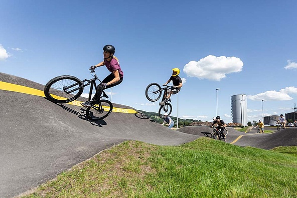 Group of cyclists on the pump track