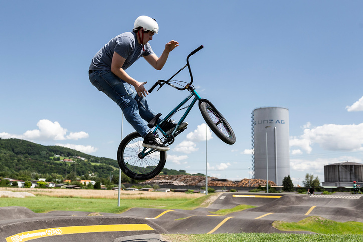 BMX rider does a barspin