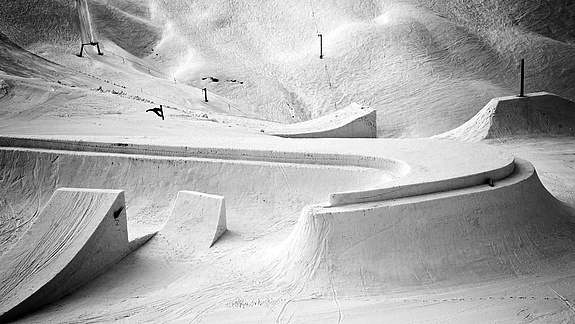 Snowboarder bounces on shaped Nike logo