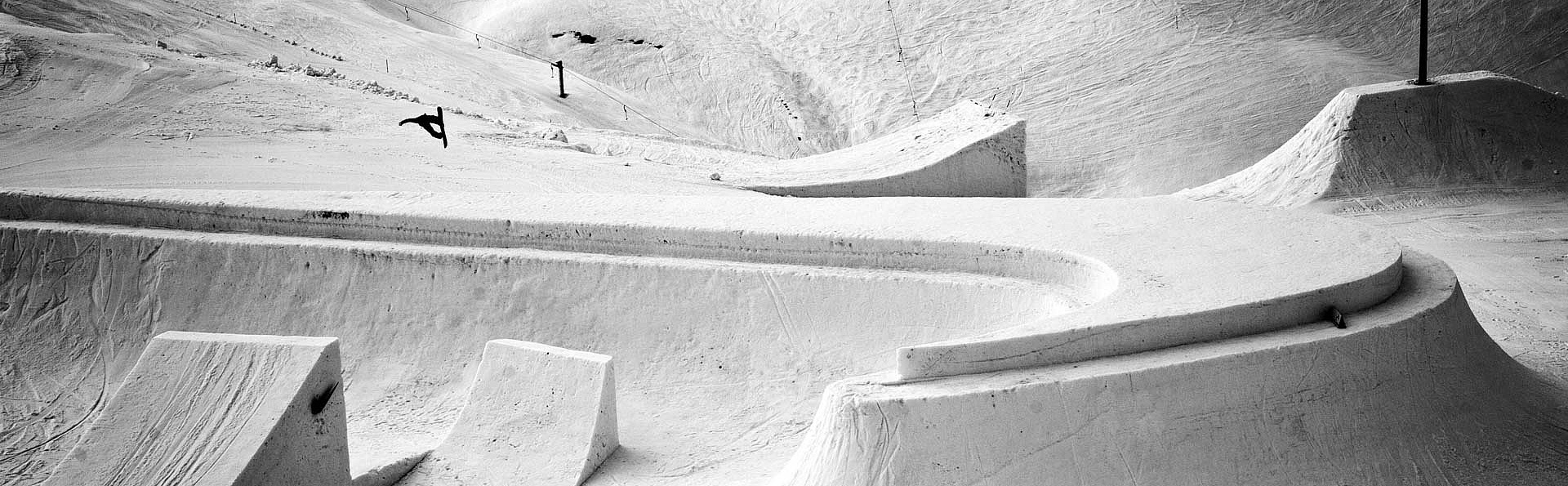 Snowboarder bounces on shaped Nike logo