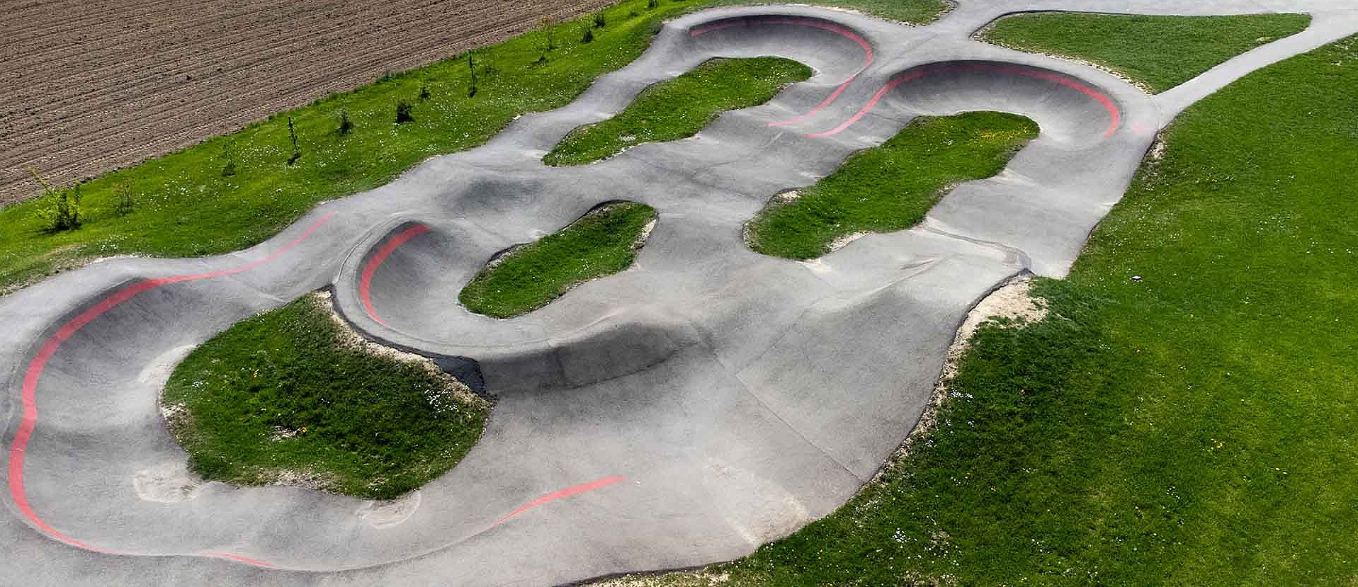 Panorama of the Staig pump track with bowl element and marked curves