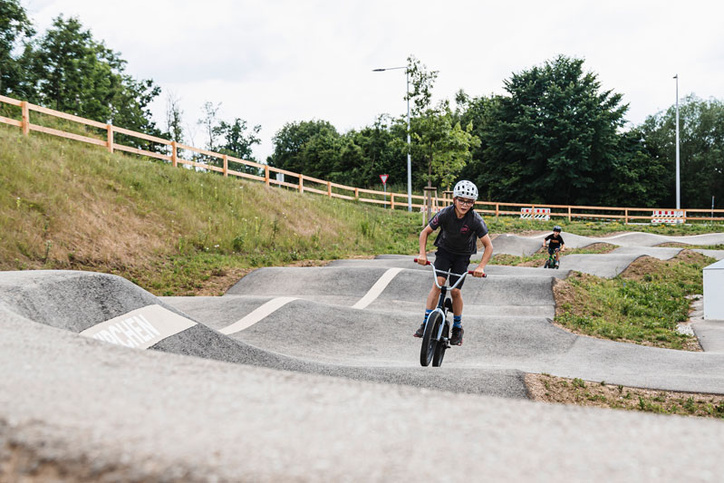 Young rides towards camera in Gunskirchen pump track