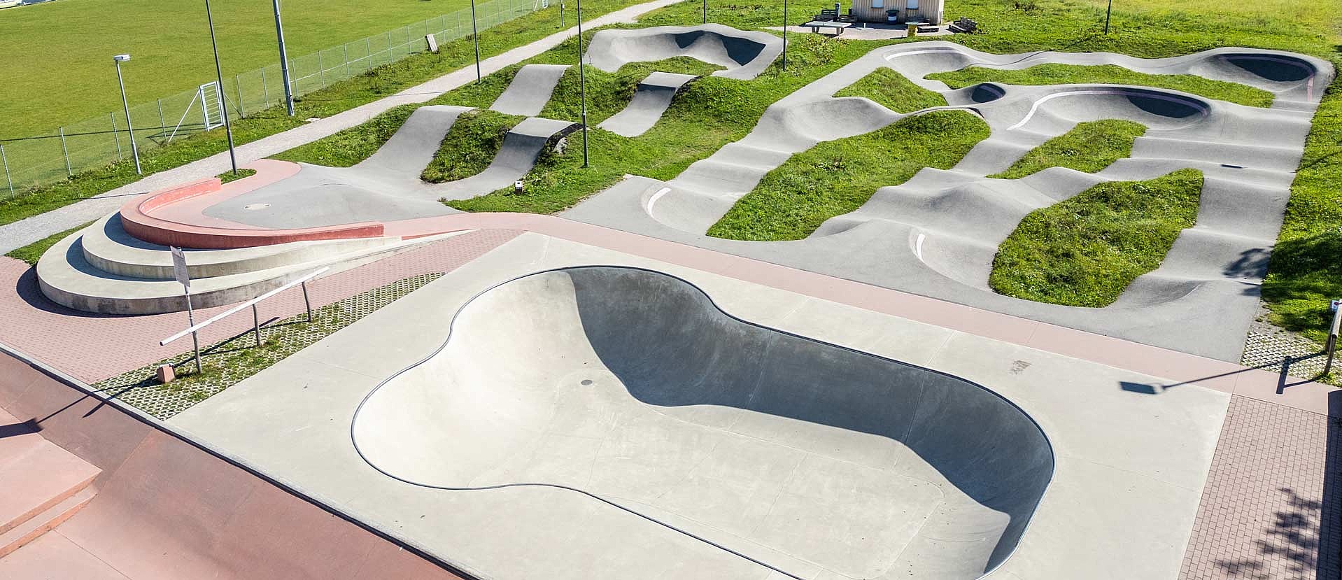 Skate park area with banks, ledges, rails and bowl in the Urban Sports Park Füssen - perfect for skaters.