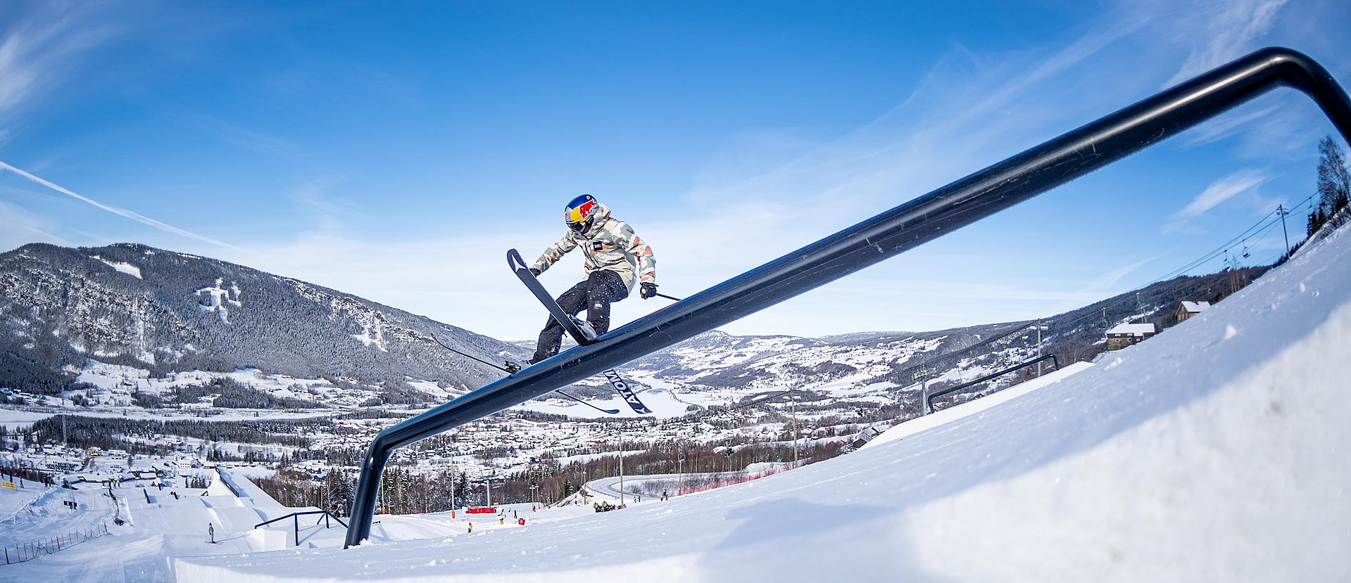 Freeski pro grinds over a rail at X Games Norway 2020
