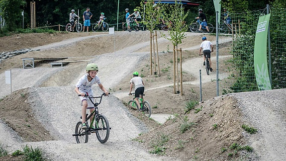 Child rides on unpaved practice course