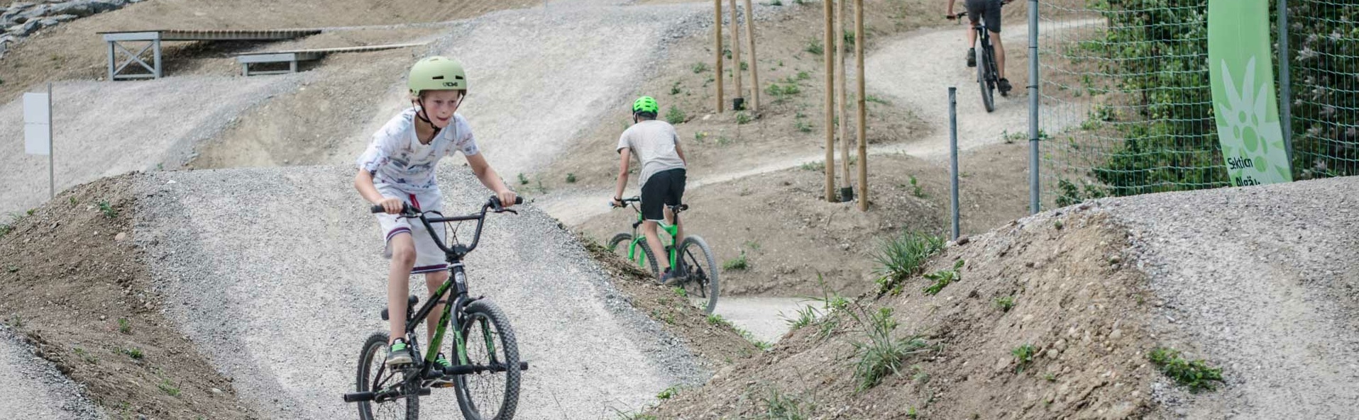 Child rides on unpaved practice course