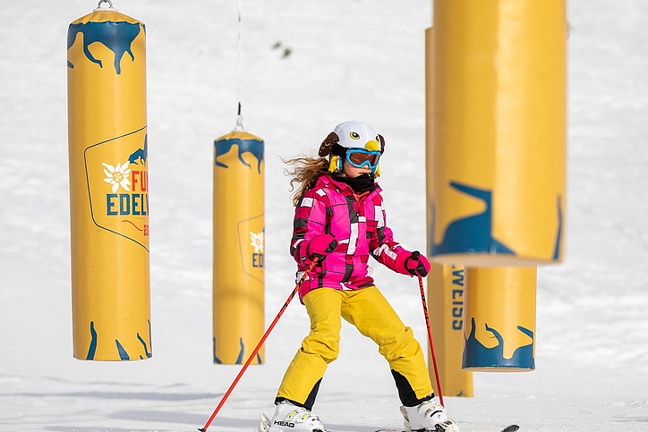 Girl skiing through pendulum