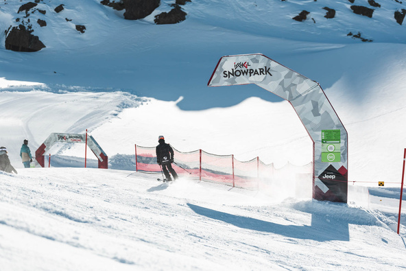 Portal and arch with two skiers