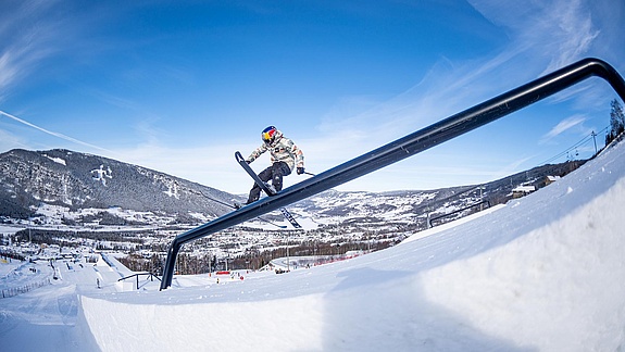 Freeski pro grinds over a rail at X Games Norway 2020