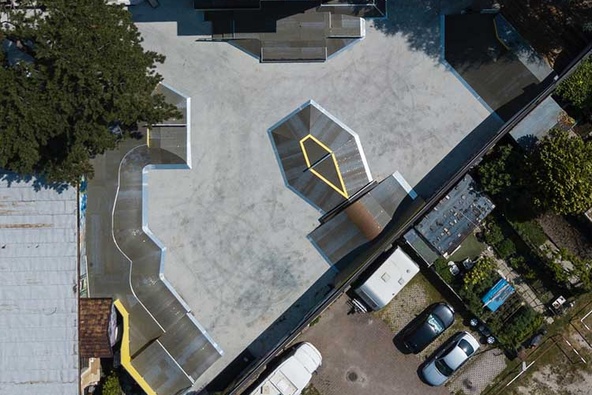 Vertical aerial shot of Meran skatepark showing the geometric design and placement of ramps.