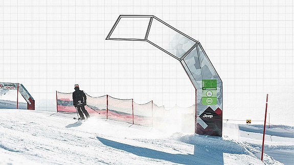Picture and drawing of a half arch through which a skier has skied
