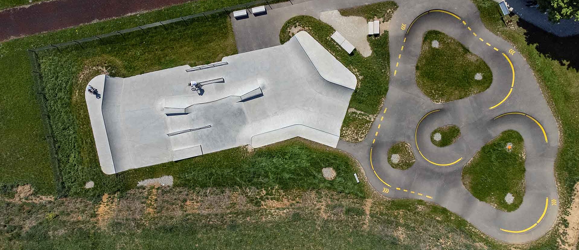 Street and park elements of the concrete park in Uhingen with BMX riders
