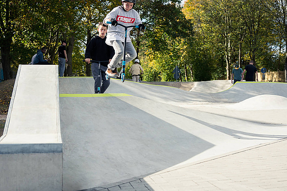 Scooter rider jumps in skate park Hennef