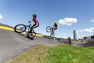 Group of cyclists on the pump track