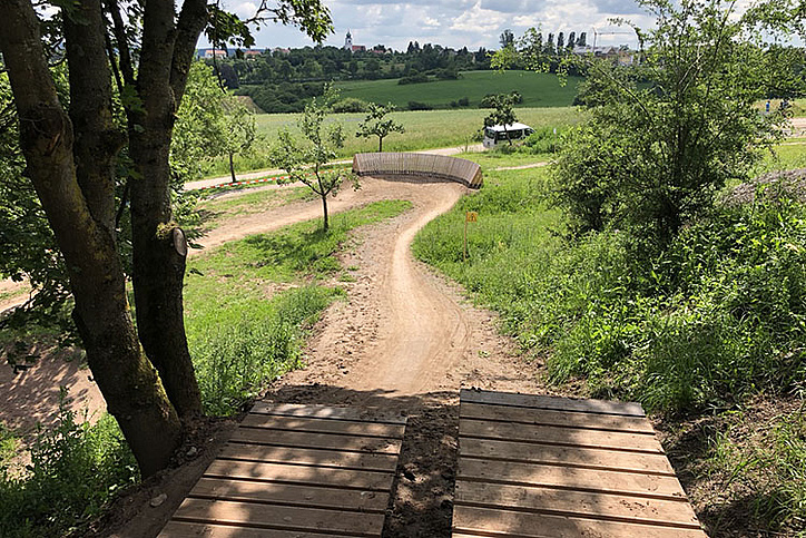 Starting ramp with view of the track and wooden berm in Herrieden Bike Park