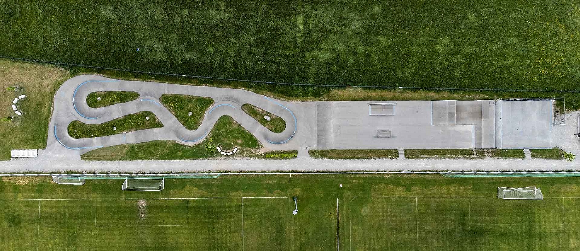 Wide view of Urban Sports Park Uffing with fields in the background