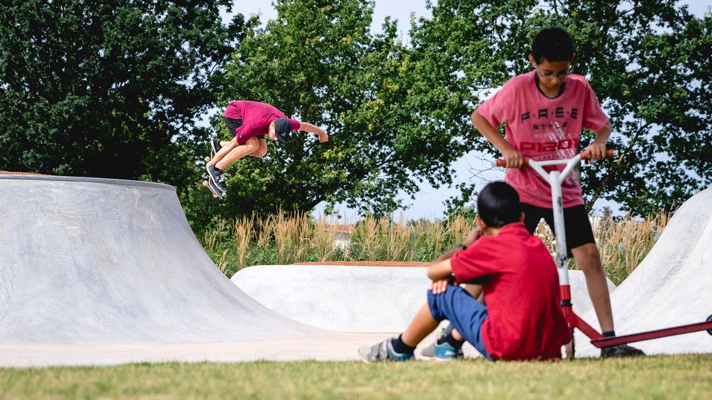 Children watching skaters at the Reese park skate park in Augsburg