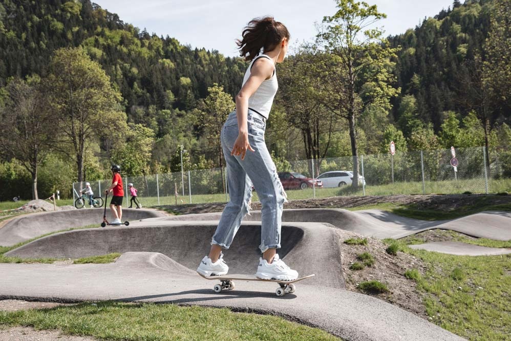 Girl on skateboard in pump track