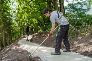 Worker creates gravel path