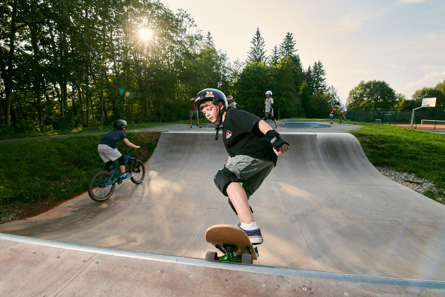 Boy on skateboard into a mini ramp